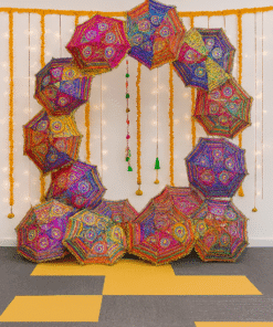 Umbrellas and fairy lights photo booth Haldi/Mehndi Decor