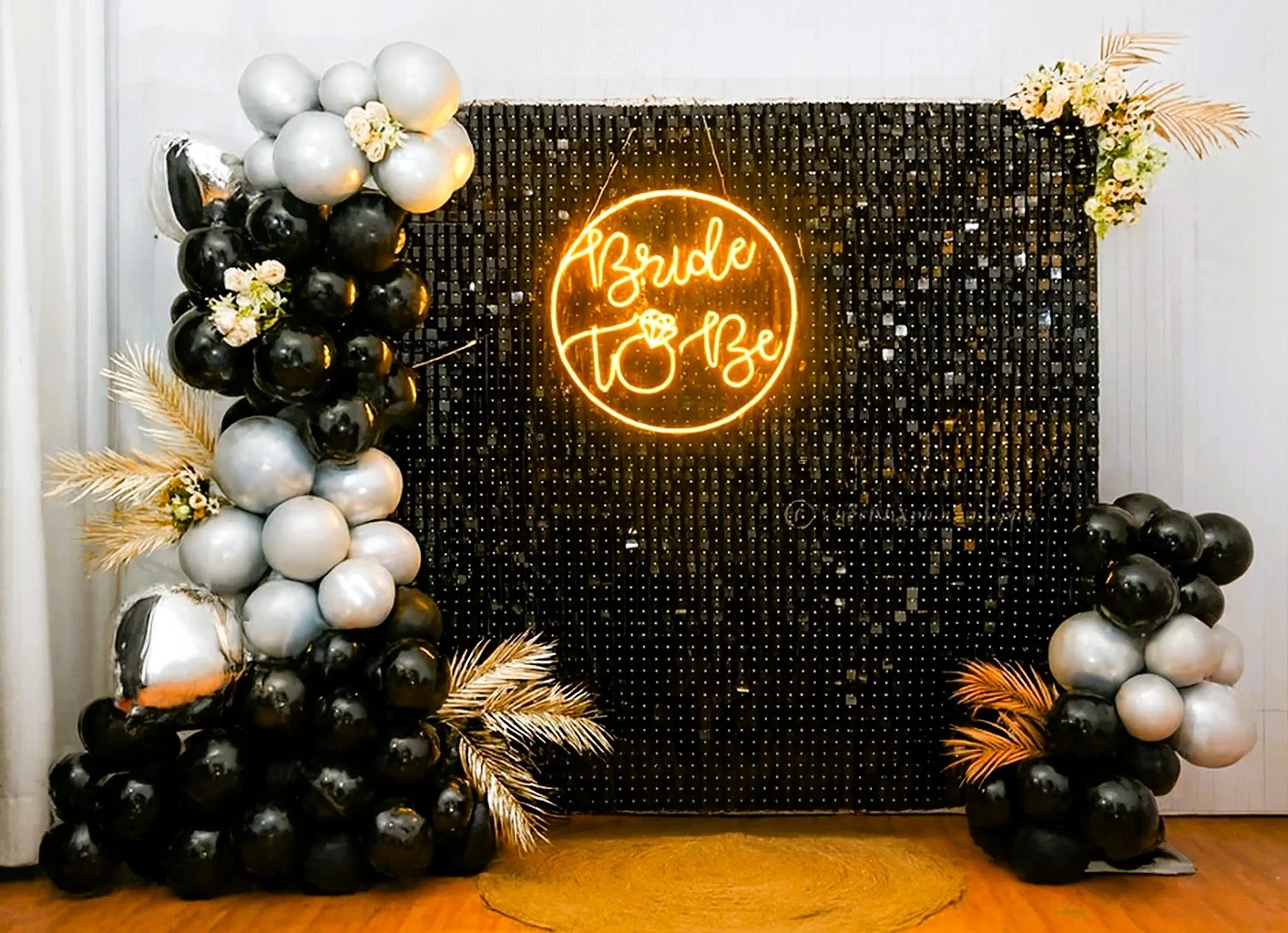 Black sequin bride-to-be backdrop for a bachelorette party