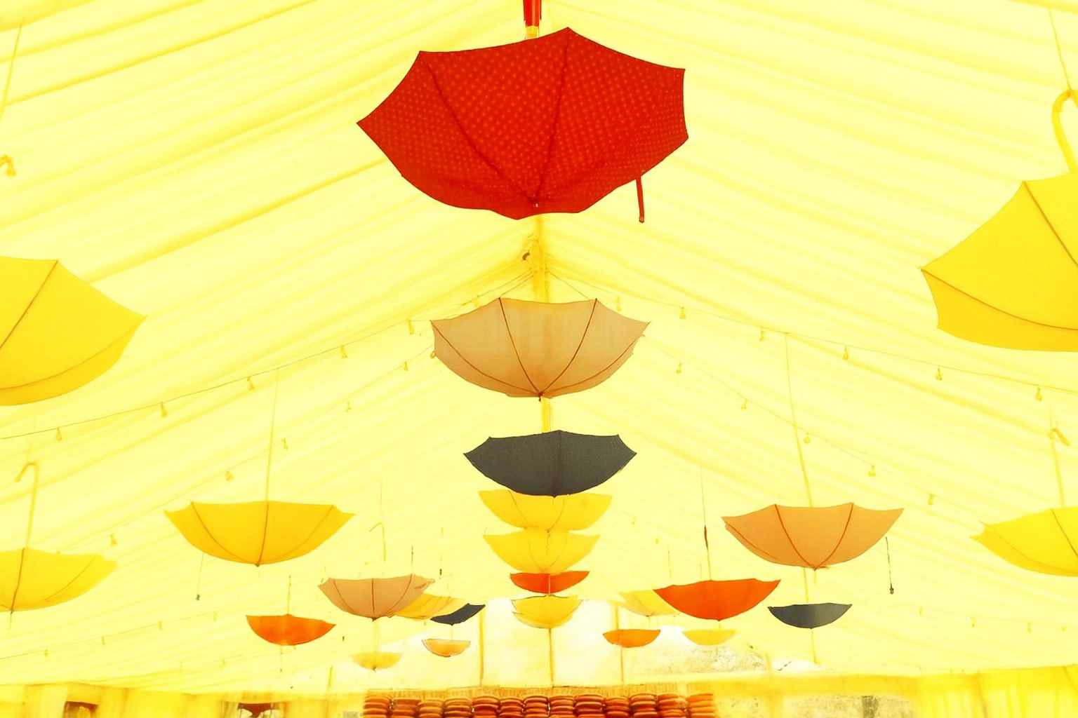 Colourful umbrella Holi decoration for a festive venue