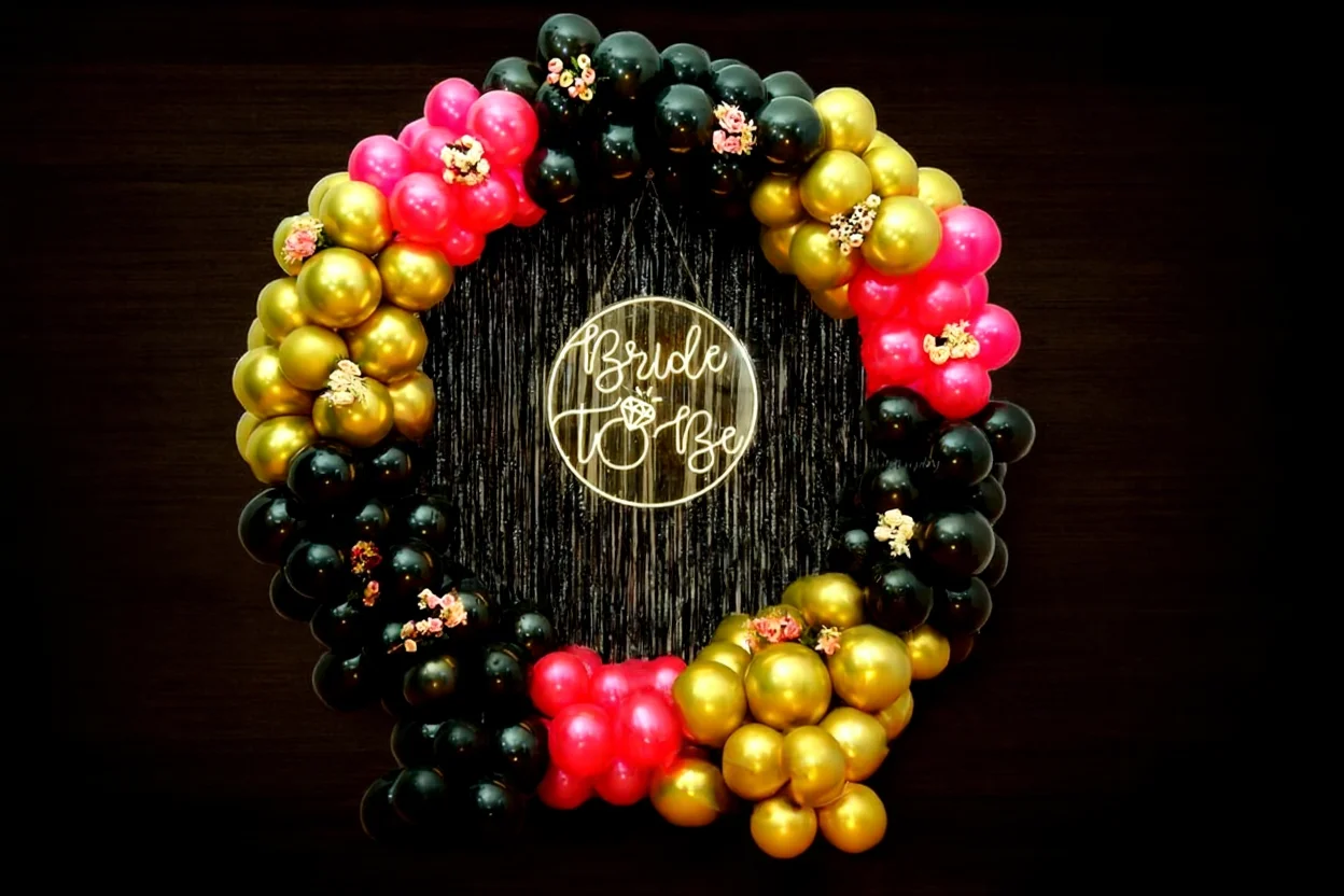 Chic noir bachelorette party decoration with a black sequin backdrop
