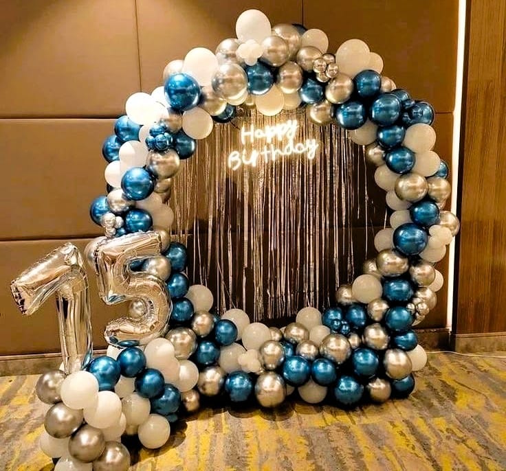 White and blue birthday decoration at home with elegant themed styling
