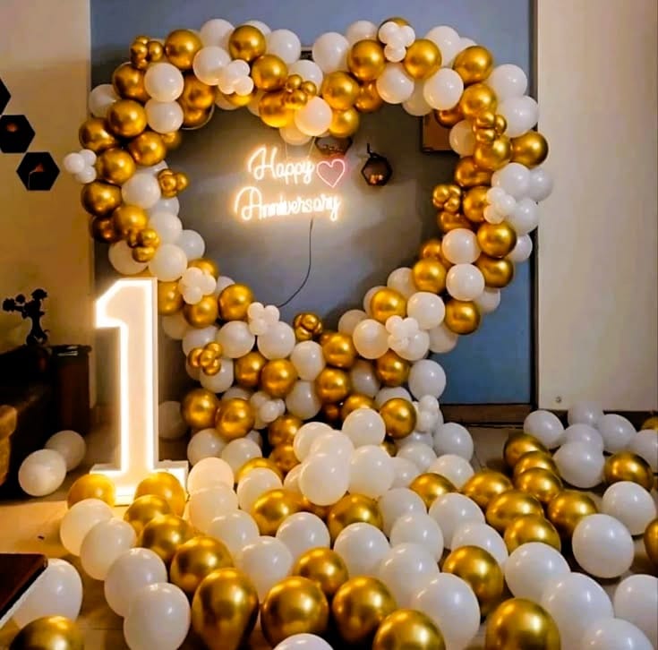 heart shaped golden and white first anniversary decor