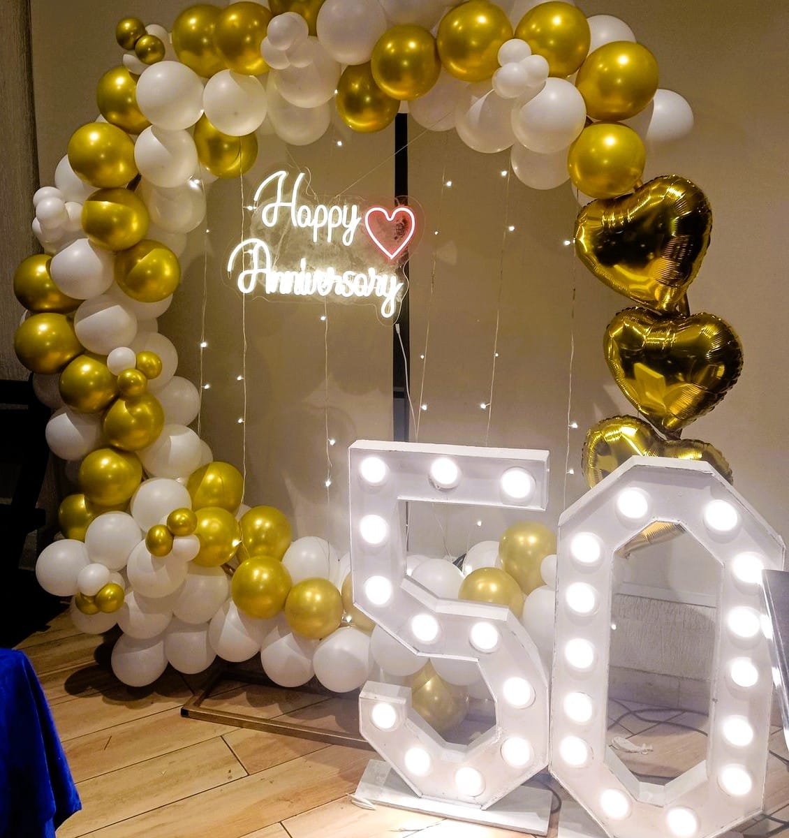 ring backdrop golden and white 50th anniversary decor