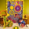 Illuminated mandala backdrop with yellow garlands, two Rajasthani umbrellas and a selfie hoop beside wooden tables
